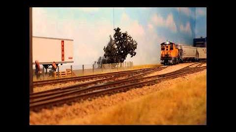 Atlas O-Scale Union Pacific MP15 with two hopper cars