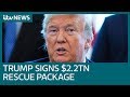 Covid-19: US President Donald Trump signs unprecedented $2.2 trillion rescue package | ITV News