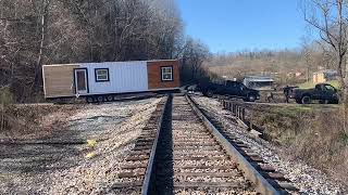 TINY HOUSE STUCK IN THE MUD AND STUCK ON THE RAILROAD WITH A TRAIN COMING!!!!