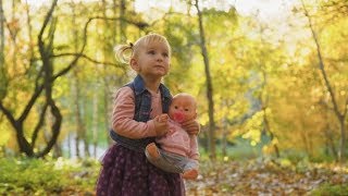 Little Cute Baby Girl Stand with Doll in the Park | Stock Footage - Videohive screenshot 5
