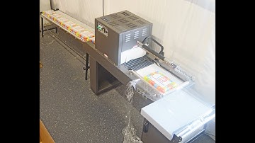 Shrink wrap system with conveyor