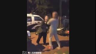 Two chinese men engage in a spitting fight