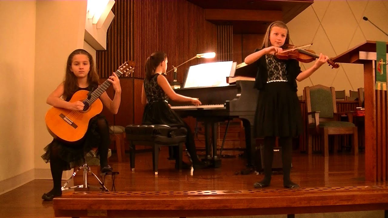 Canon in D on piano, violin, and classical guitar.