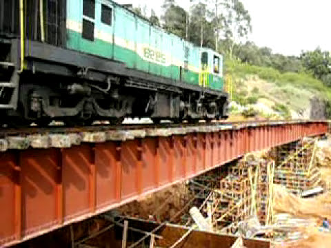 A train runs on a temporary bridge supported on