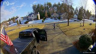 Guy throws football then boy runs to catch it and bumps into tree (Security camera)