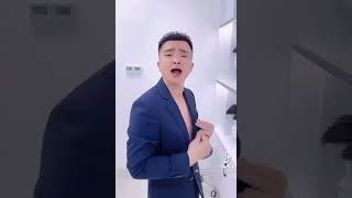 Bald Chinese guy singing