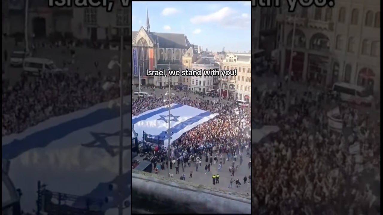HUGE crowd in the Netherlands displays a massive Israeli flag in solidarity with the Jewish state.