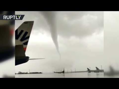 Damaged planes & toppled buses: Tornado wreaks havoc on Turkish airport