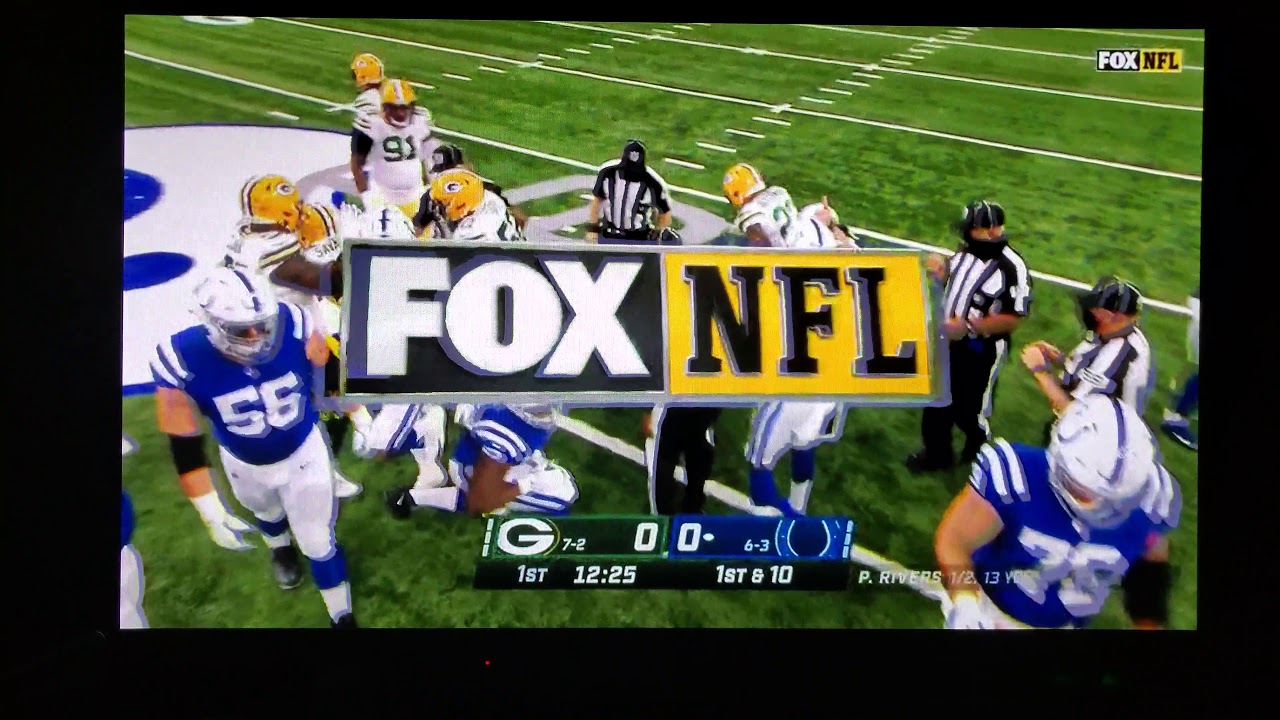 Raven Greene #24 punching out turnover back Packers/Colts