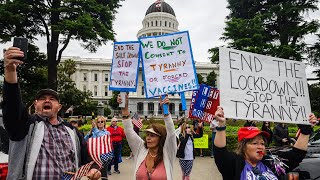Demonstrators converged on the california capitol in sacramento
monday, april 20, 2020, to protest state's stay-at-home orders slow
spread of t...