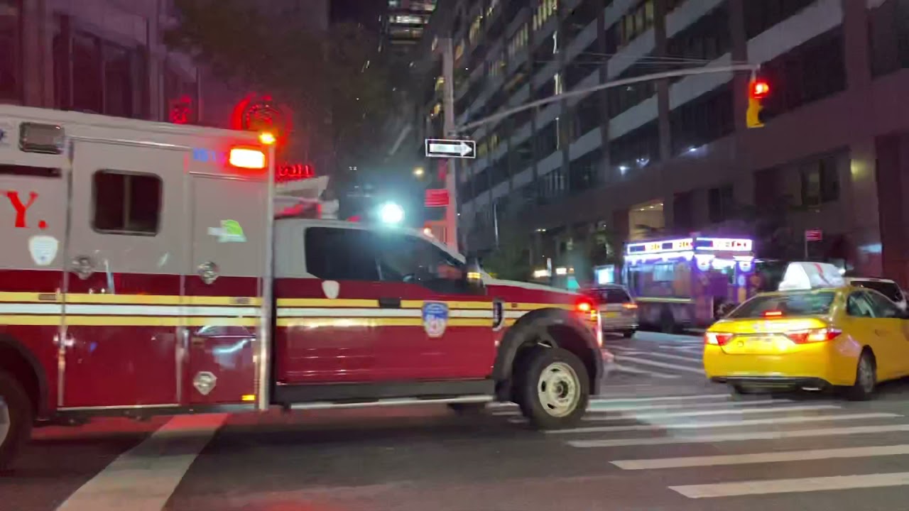 FDNY EMS AMBULANCE, USING HILO SIREN, WHILE RESPONDING ON 7TH AVENUE IN MIDTOWN, MANHATTAN, NEW YORK