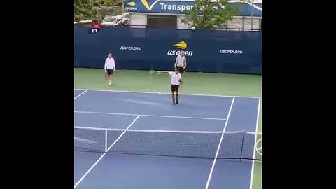 Roger Federer with the casual heavy backspin drop shot that bounces back over the net