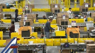 Amazon employees busy getting your holiday packages ready