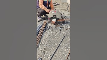 Workers cutting steel tube to close manhole formwork