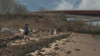 Volunteers gather in South Portland on Saturday as part of city-wide cleanup effort