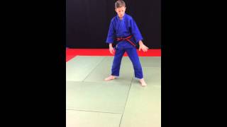 Kid coach demonstrates the Yoko Ukemi (Side Breakfall)