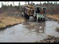 Homemade forwarders logging in wet forest, deep water and mud