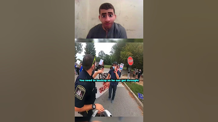 Protesters try to stop biker in the middle of the road 😱