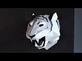 Papecraft sculpture of tiger head hyperlapse of assembling