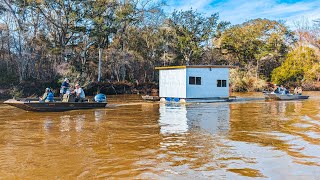 Moving a brand new houseboat up a flooded river!