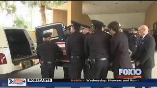 Hundreds line funeral procession route