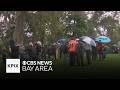 People brave the rain to celebrate 4/20 at Hippie Hill in San Francisco