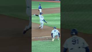 Shohei Ohtani tags second and sprints for third, beating the throw to Kazuma Okamoto in a close play