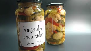 Pickled vegetables in vinegar. Packaged and sterilized, they last a long time in the jar.