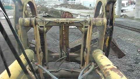 moving scrap with a log loader