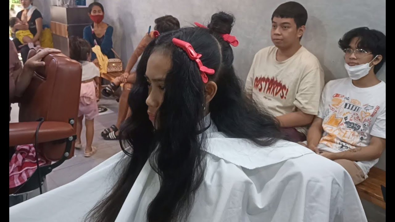 Mother watches her daughter get a severe summer haircut