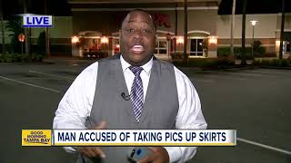 Man accused of taking pics up women's dresses