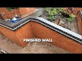 Bricklaying  the great wall of wigan finished 