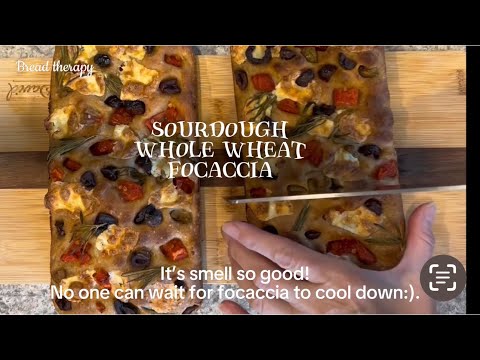 Delicious sourdough potatoes whole wheat focaccia with cheese, olives, tomatoes, rosemary.