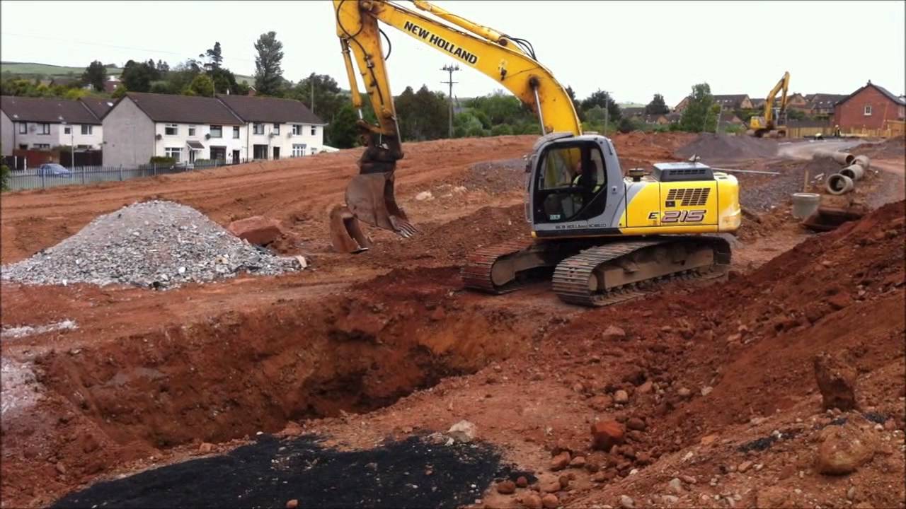 NEW HOLLAND 215 EXCAVATOR