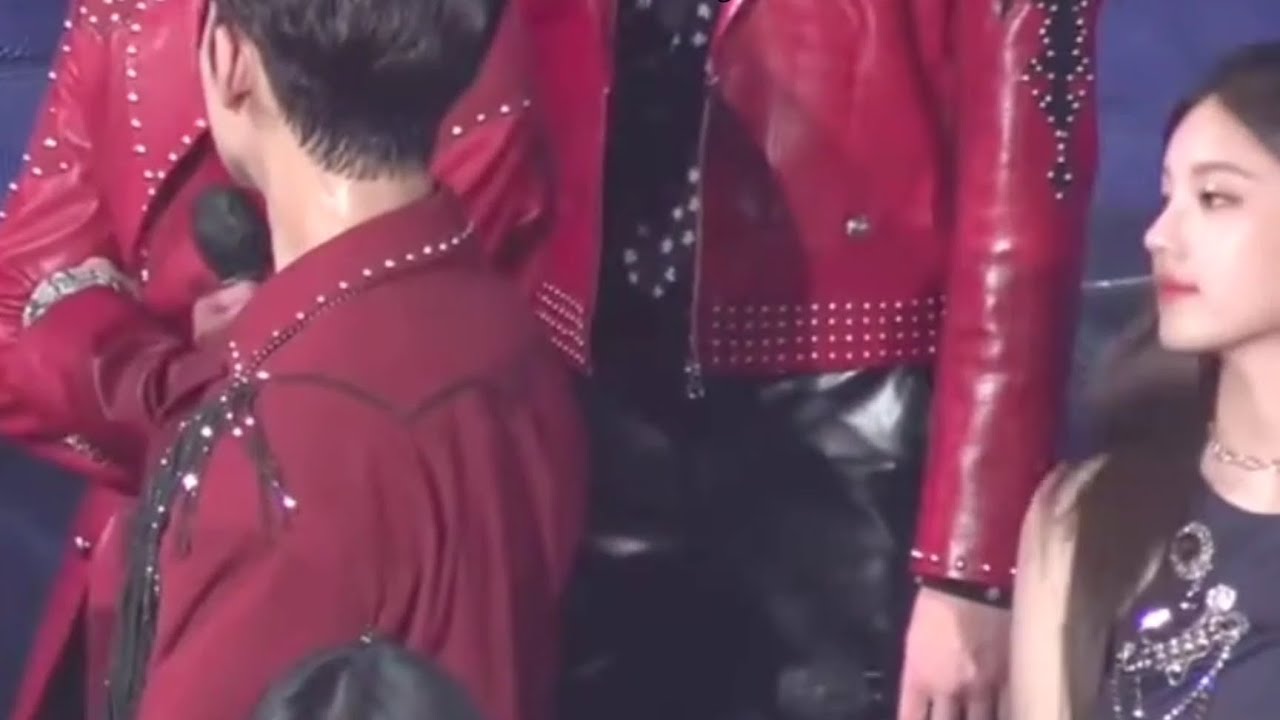 Mingyu and Yeji look at each other at the 2021 KBS song festival