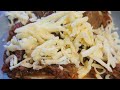 Cooking loaded spuds in a pizza oven on live