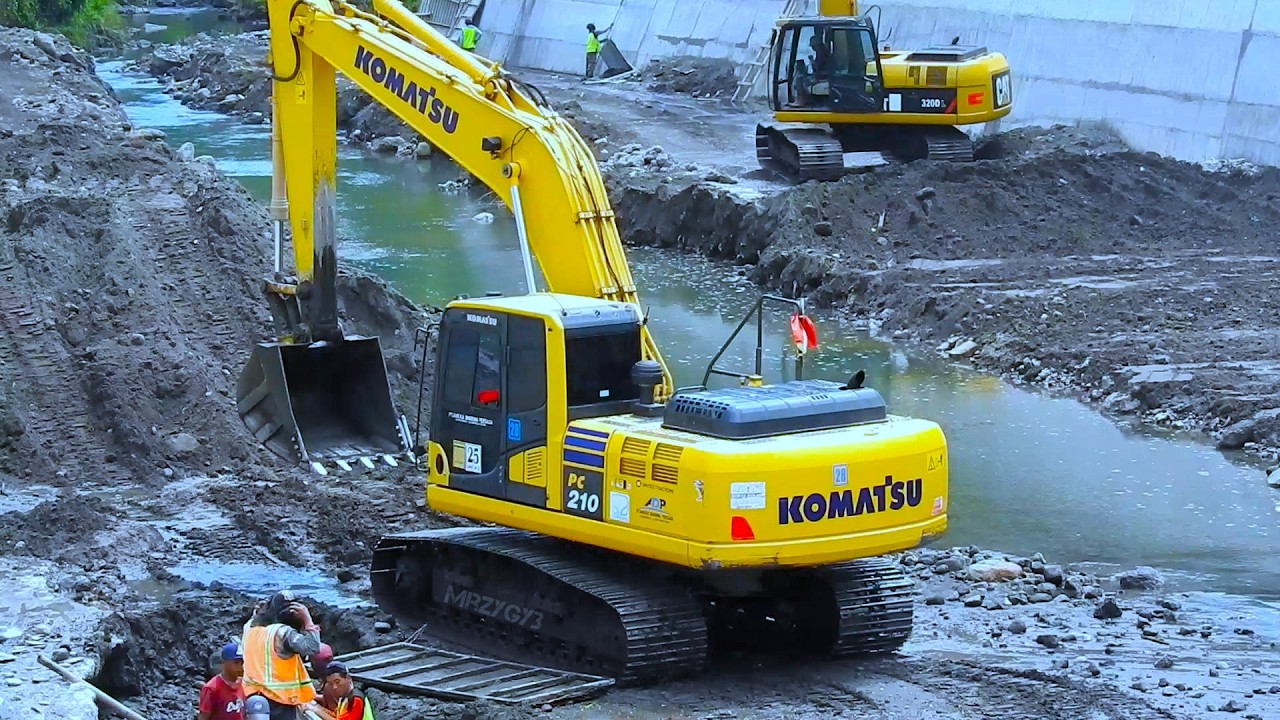 Riverbed Sedimentation Clearing Using Long Reach Excavator - YouTube