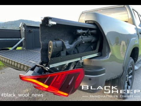 Toyota Hilux lockable, hidden (concealed) rearlight gun compartment by Black Sheep Innovations GmbH