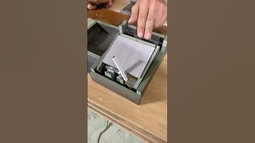 Hộp lấy thuốc lá tự động kiêm gạt tàn thuốc