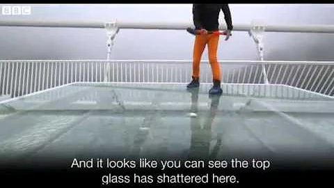 China's giant glass bridge hit with sledgehammer