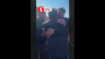Palestinian twins share emotional embrace after a year apart