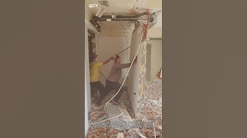 "Demolition Gone Wrong! Two Men Topple a Wall with Bare Hands 🏚️💥