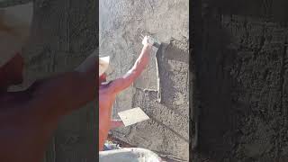 Plastering the brick wall