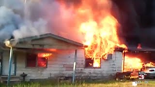 Men pull elderly man to safety after house fire