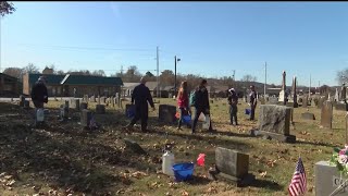 Volunteers clean headstones in historic area of Prairie Grove​ Cemetery