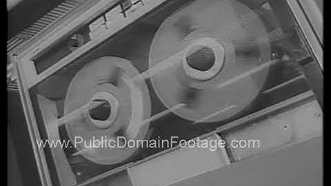 Late 1960s computer mainframes with tape archival newsreel footage
