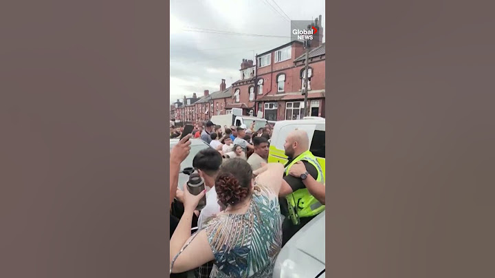 Chaos in Leeds as rioters set bus ablaze, overturn police car