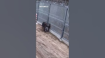 Thumbnail of Polish border guards stop migrants cutting through barrier