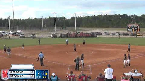 #23 Rachel Paulk yaks the ball deep to left field ...