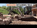 Time to build the huge natural boulder retaining wall behind the house mini excavator